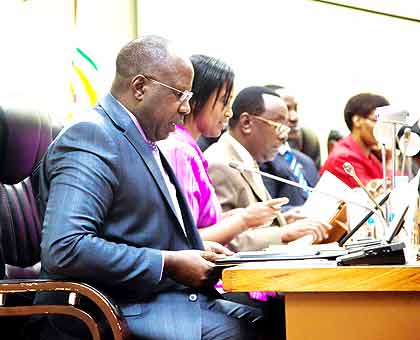 Prime Minister Habumuremyi presents highlights of activities that government plans to fast-track in the Financial Year 2013/14 to Parliament yesterday. The New Times/ T. Kisambira.