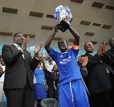 Rayon Sports skipper Aphrodis Hategikimana lifts the Primus League title last season at Amahoro stadium.  Saturday Sport/ J. Mbanda
