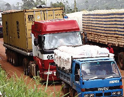 Cargo trucks wait to be cleared at Uganda-Rwanda border. The Comesa yellow card eases driversu2019 movements across the trading bloc. The New Times / File