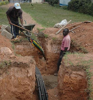 Men laying fibre optic cables. Rwanda is increasing broadband network to ensure Rwandans access cheap and reliable Internet The New Times / Net