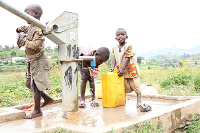 Children draw water at a borehole in a village in Karongi District. The New Times/ File.