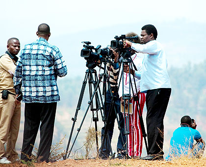 Journalists interview a source. The EAC Summit will discuss the proposed regional media council. The New Times/File