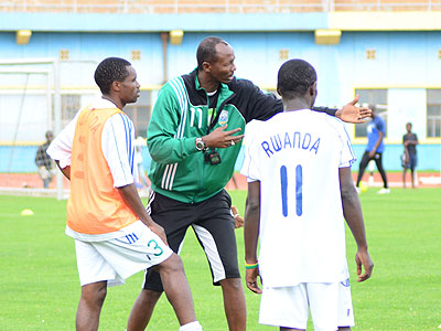 Eric Nshimiyimana talks to his players during a training session ahead of last Saturday's friendly against Uganda. Times Sport/Plaisir Muzogeye