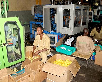 Workers at a factory in Kigali. Members of the private sector have expressed concerns over power outages. The New Times/John Mbanda