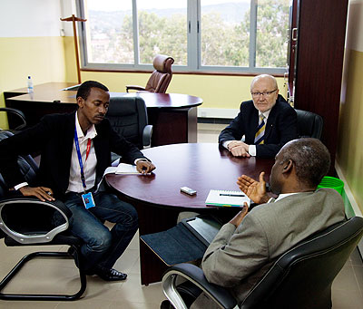 The writer interviews professors James McWha and Nelson Ijumba at the University of Rwanda. The New Times/Timothy Kisambira