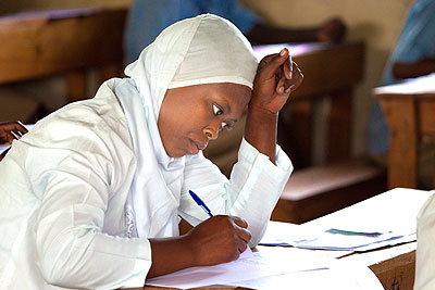 A student writing her final exams. Education Times / T. Kisambira. 