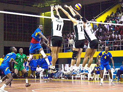 Egyptians players jump to block a spike. They won Rwanda in a set of three to one. The New Times/Timothy Kisambira