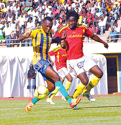 Amavubi Stars striker Meddie Kagere (L) battles for the ball with Uganda Cranes defender during a friendly played in February in Kigali that ended 1-1.  Times Sport / File.