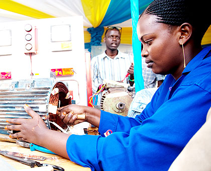 Mediatrice Mukansaga, a student at VCT Gacuriro, makes a motor rewinding system  at the ongoing  TVET expo yesterday. The New Times/ T. Kisambira.