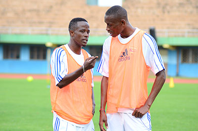 Amavubi Stars captain Niyonzima (L) and his assistant Mugiraneza share a point in training. Rwanda lost to Uganda at Nyayo stadium yesterday. Saturday Sport / T.  Kisambira.