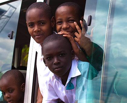 Children in a bus coming from school. The New Times/Timothy Kisambira