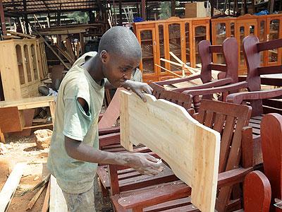 A young man at work in Gakinjiro. The New Times/Timothy Kisambira