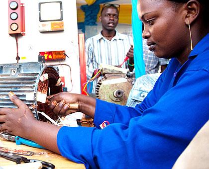 Mu00e9diatrice Mukansaga, a student at VCT Gacuriro making a mortar rewinding system at the ongoing  TVET expo. Sunday Times/Timothy Kisambira
