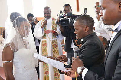 Tom Close puts a ring on Triciau2019s finger.