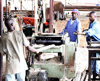 Carpenters in a workshop in Gacingiro.  The new leasing model will allow small  and medium scale enterprises access to better equipment.   The New Times/ T. Kisambira.