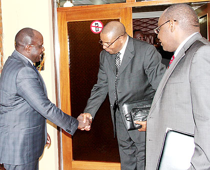 Prime Minister Pierre Damien Habumuremyi (L) bids farewell to Kalyalya as Amb. Gatete looks on yesterday.   The New Times/ John Mbanda.
