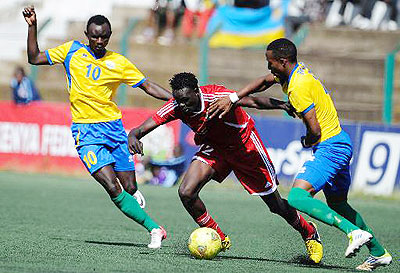 Sudanu2019s Ibrahim Salah (C) vies with Amavubiu2019s player Mohamed Mushimiyimana (L) and teammate Emery Bayisenge in Nairobi. The New Times/Courtesy.