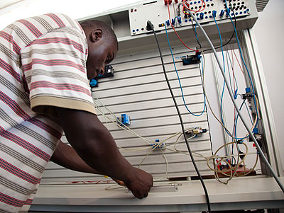 A student of electronics demonstrates his skills at a recent TVET expo. The New Times / T. Kisambira.