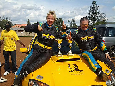 Giancarlo and Vindevogel celebrate their National Rally Championship victory after taking home the Rally de Mille Collines title.  The New Times / Courtesy.