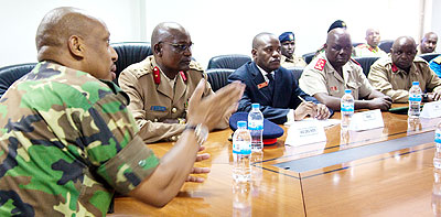 Gen. Nyamvumba (L) addresses the delegation from the Kenyan National Defence College at the Defence and Military headquarters yesterday.   The New Times/ Timothy Kisambira.