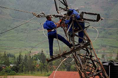 EWSA workers fixing up electric cables.  The New Times/ Timothy Kisambira.