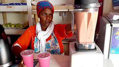 Mujawajambo makes her juices. Business Times/ Ben Gasore.