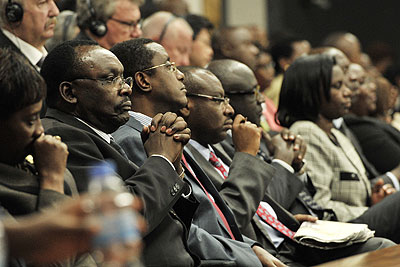 Some government officials follow the Presidentu2019s Address.  Courtesy.