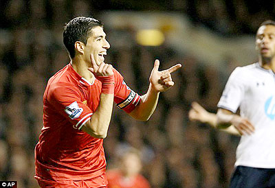 Luis Suarez, captain for the day, celebrates giving Liverpool the perfect start against Tottenham. Net photo