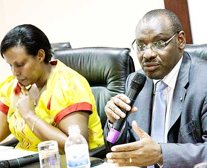 Amb. Gatete (R) with Gasinzigwa at the launch of the National Financial Education Strategy yesterday.   The New Times/ John Mbanda.