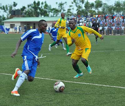 Rayon right back Karim Ndagijimana (L) battles with AS Kigali's Ngirinshuti Mwemere during the Super Cup match.  AS Kigali won 1-0. Saturday Sport / T. Kisambira.