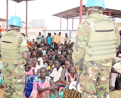 Rwandan peacekeepers under the UN Mission to South Sudan watch over civilians under their guard in South Sudan last week. Parfait Gahamanyi, the director-general of Diaspora Directorate at the Ministry of Foreign Affairs, said Rwandans who wish for evacuation will be helped.  The New Times/ Courtesy.