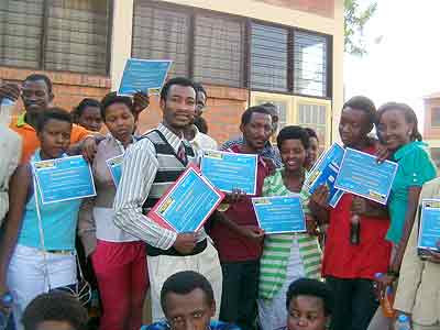 Students showing off their certificates after the training. Education Times/ Susan Babijja.