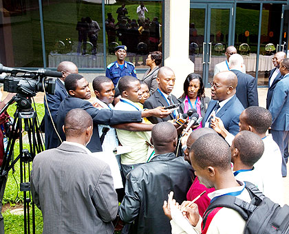 Journalists interview Local Governmemt minister James Musoni after a past function in Kigali. The New Times/ Timothy Kisambira.