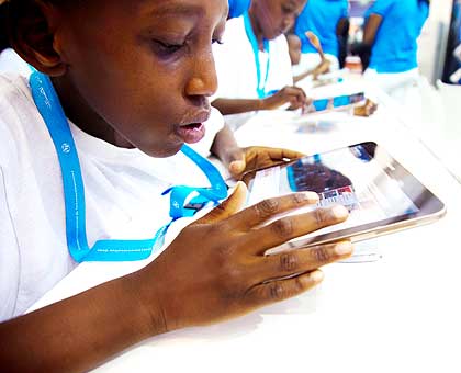 A child using a tablet during the Transform Africa 2013 Summit in Kigali in October.The New Times/ File.