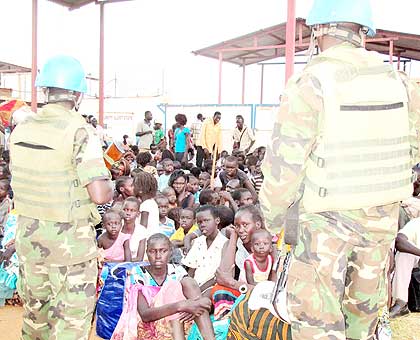 Rwandan peacekeepers watch over displaced persons in Juba. The New Times/ File.