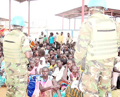 Rwandan peacekeepers watch over displaced persons in Juba. The New Times/ File.