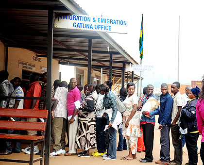Travellers have their documents stamped at Gatuna border post at the Rwanda-Uganda border. The New Times/ File.