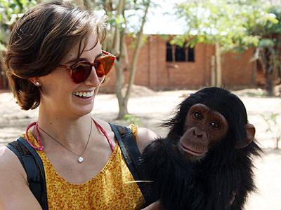 Kim cradles the baby chimp, Avril. Sunday Times/Courtesy