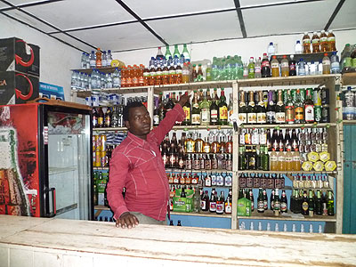 Ngenzi in his bar, one of the three enterprises he owns. The New Times / S. Habimana