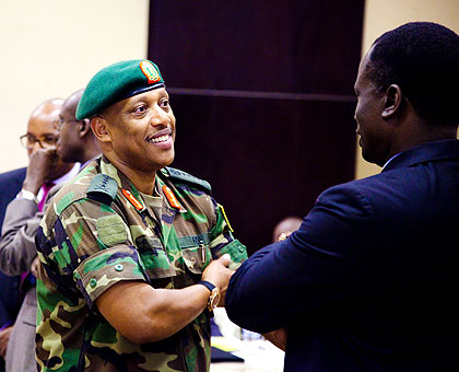Gen. Patrick Nyamvumba, the Chief of Defence Staff of the Rwanda Defence Forces (L), chats with Maj. Gen. Francis Okello, from Uganda, in Kigali yesterday. Defence and Police chiefs from Uganda, Kenya and hosts Rwanda met in Kigali to discuss a common security pact that will help combat terrorism and cross-border crime in the three countries. The New Times/ Timothy Kisambira.