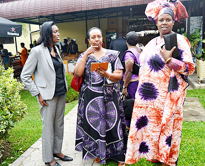 MP Nyirarukundo (L) chats with colleagues after the committee elections in Musanze District yesterday.   The New Times/ Jeandu2019Amour Mbonyinshuti.