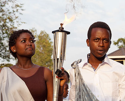 Youths carry the Kwibuka Flame to start the lap of honour throughout the country after it was lit at Kigali Genocide Memorial Centre in Gisozie on Tuesday. The New Times/Timothy Kisambira