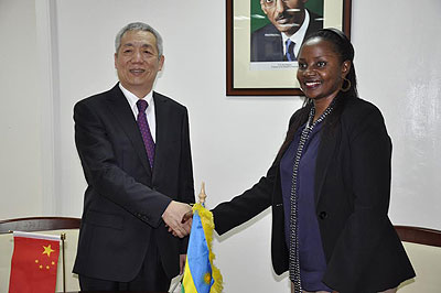 Shen Yongxiang, the Chinese ambassador to Rwanda, and Emma Francoise Isumbingabo, the state minister in charge of energy and water after  the former handed over the equipment in Kigali yesterday. Courtesy.