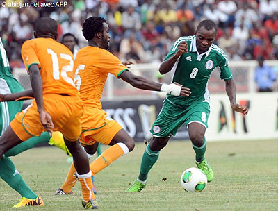 Sunday Mba (R) played key role as Nigeria beat archrival Ivory Coast enroute to 2014 CHAN finals where the reigning African champion are favourites.  Net photo