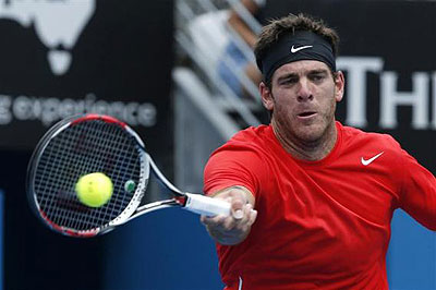 Juan Martin Del Potro of Argentina hits a return to Dmitry Tursunov of Russia during their men's singles semi-final match. Net photo.