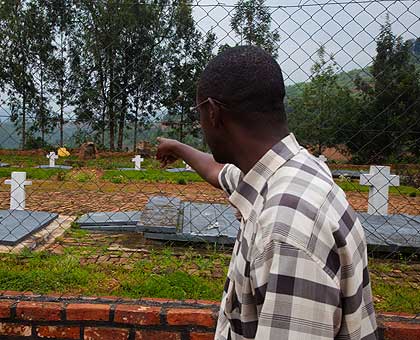 Innocent Kamanzi, 45, a survivor points at the place, he suspects his dad and siblings were buried by a bulldozer at Nyange during the 1994 Genocide against the Tutsi.   The New Times/ T.Kisambira.