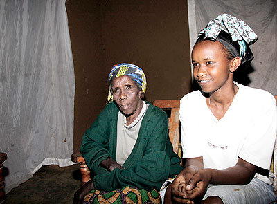 Nyiragakara (L) with grand daughter Twahirwa during the interview with this paper.   The New Times/ John Mbanda.