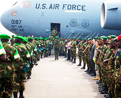 The first batch of RDF peacekeepers board a US plane at Kigali International Airport yesterday. The peacekeepers are being airlifted in phases to Bangui, the capital of restive Central African Republic. The New Times/ T. Kisambira.