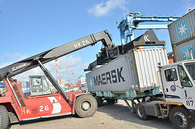 A container-handling crane forklifts cargo at Kenyau2019s Mombasa, the gateway port for imports and exports along Eastu2019 Africau2019s Northern Corridor, which covers, among others, Kenya, Uganda and Rwanda. The three countries have in recent months struck deals to jointly promote major cross-border integration projects designed to ease movement of people and goods along the Corridor. The New Times/ John Mbanda.