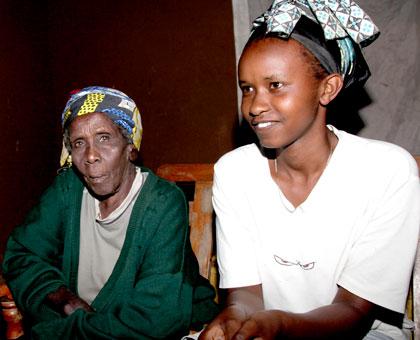 Caritas Nyiragakara (L) and Twahirwa during the interview. The Sunday Times/John Mbanda